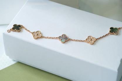 [LuckyStar] Armband aus Roségold mit Kleeblatt und 5 Motiven, dunklem Perlmutt und Diamanten 